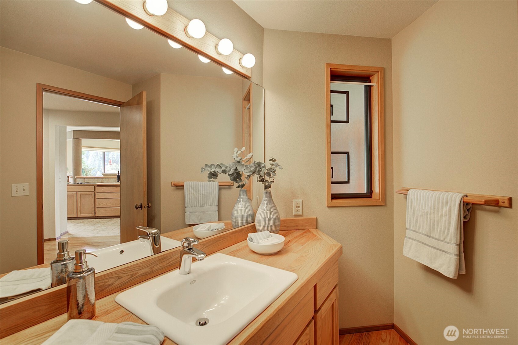 9430 Hoeder Lane Bothell, WA 98011 - Photo 20 of 39 a bathroom with a sink and a mirror