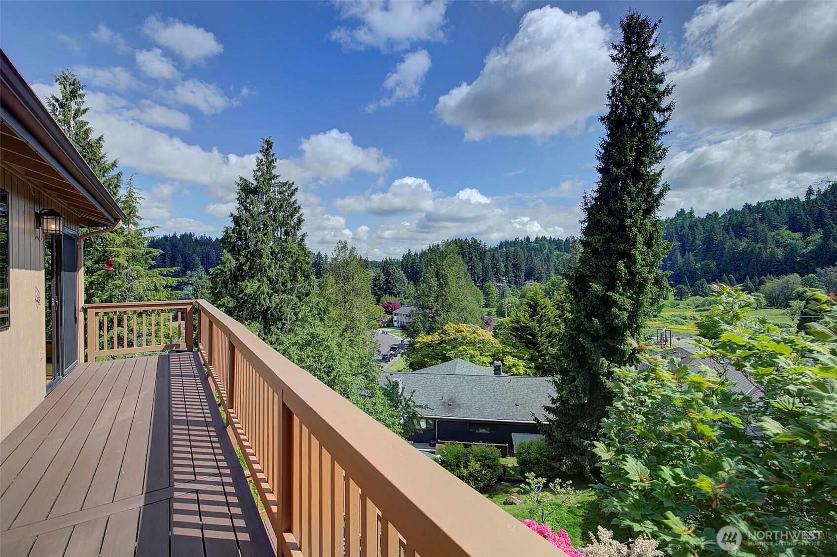 9430 Hoeder Lane Bothell, WA 98011 - Photo 21 of 39 a view of a balcony with wooden floor and fence