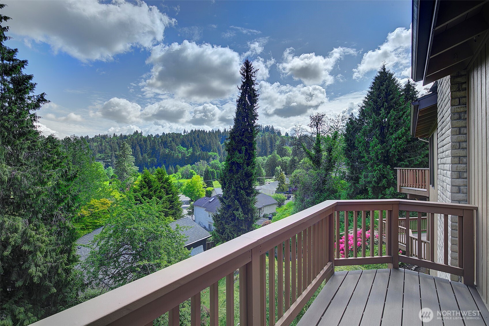 9430 Hoeder Lane Bothell, WA 98011 - Photo 22 of 39 a balcony with wooden floor and fence