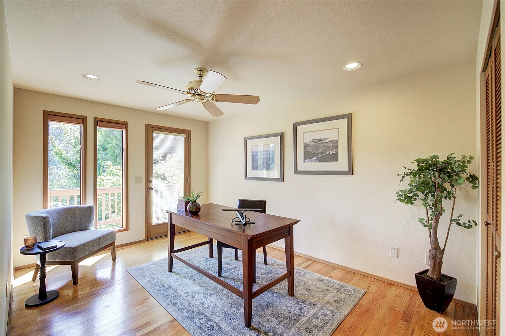 9430 Hoeder Lane Bothell, WA 98011 - Photo 24 of 39 a living room with furniture a potted plant and a window