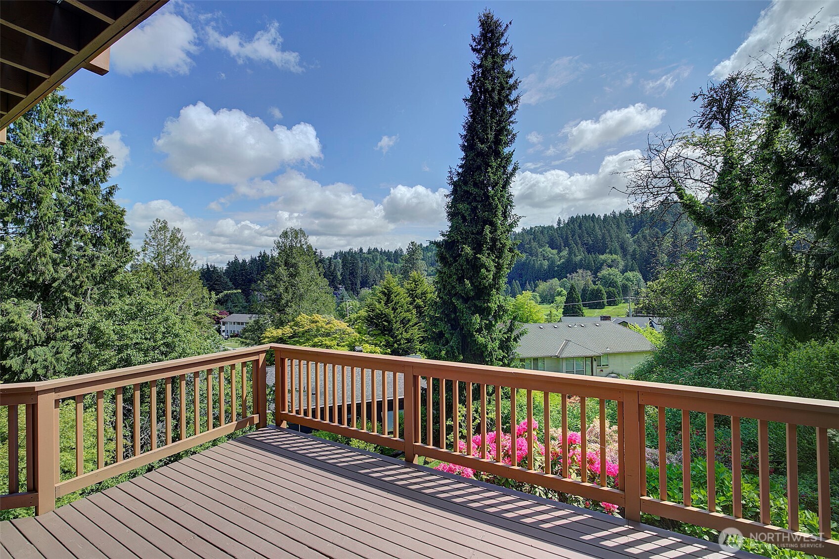 9430 Hoeder Lane Bothell, WA 98011 - Photo 32 of 39 a balcony with wooden floor and fence