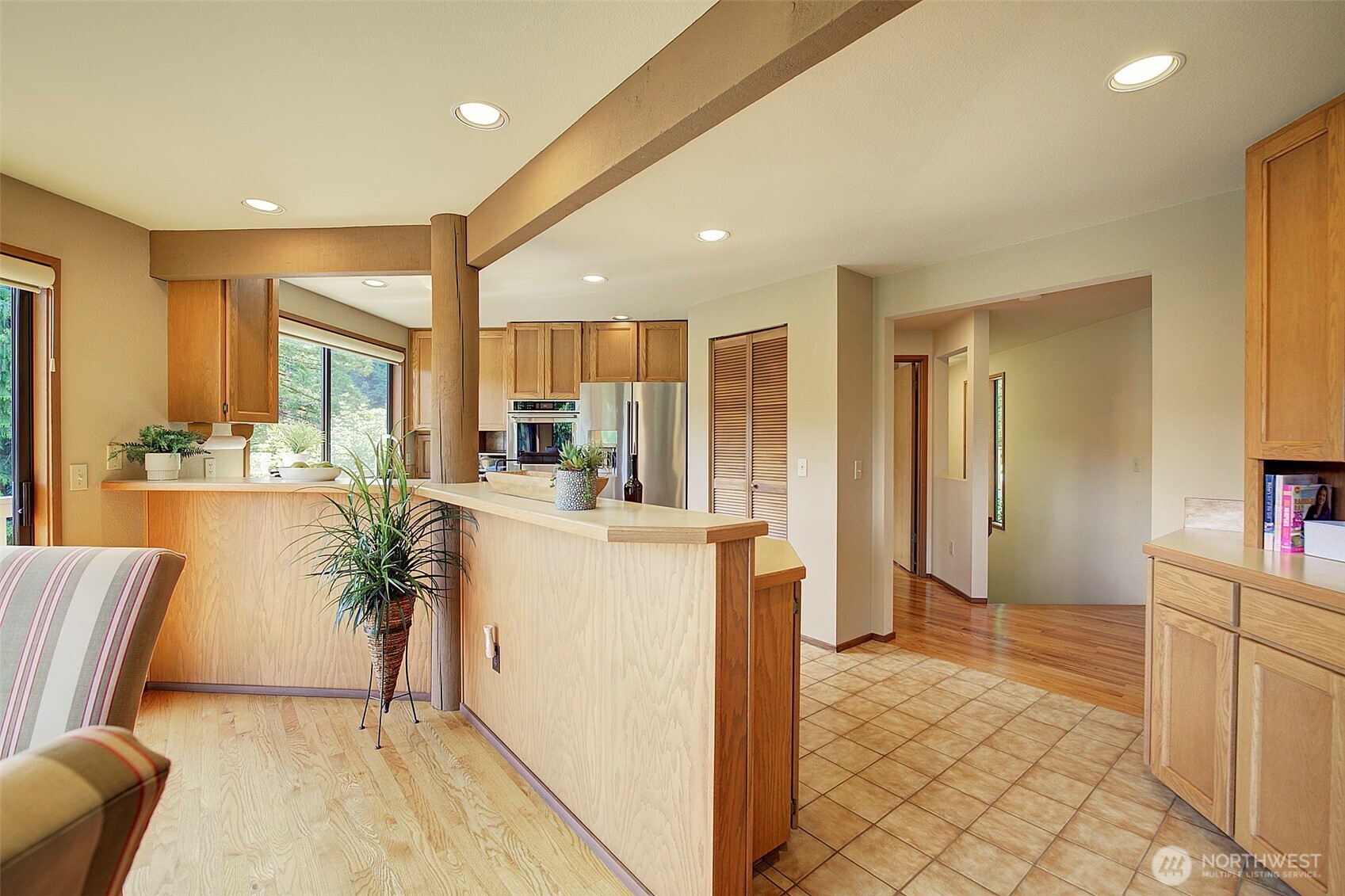 9430 Hoeder Lane Bothell, WA 98011 - Photo 10 of 39 a living room with furniture a large window with kitchen view