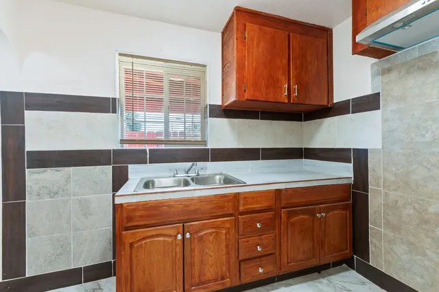 a bathroom with a sink a mirror and a window