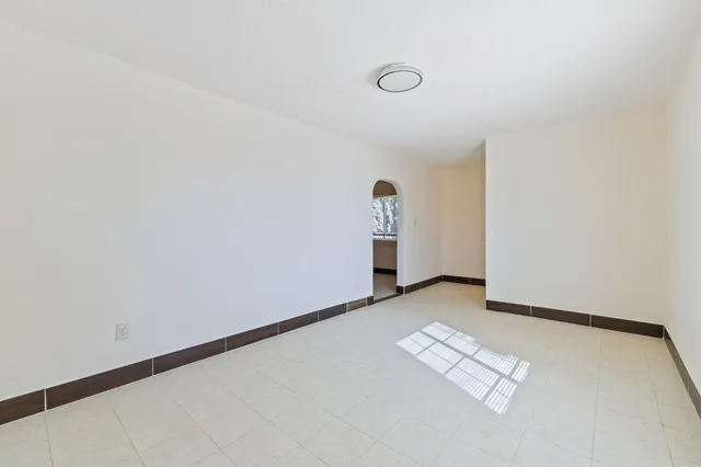 a view of an empty room and window