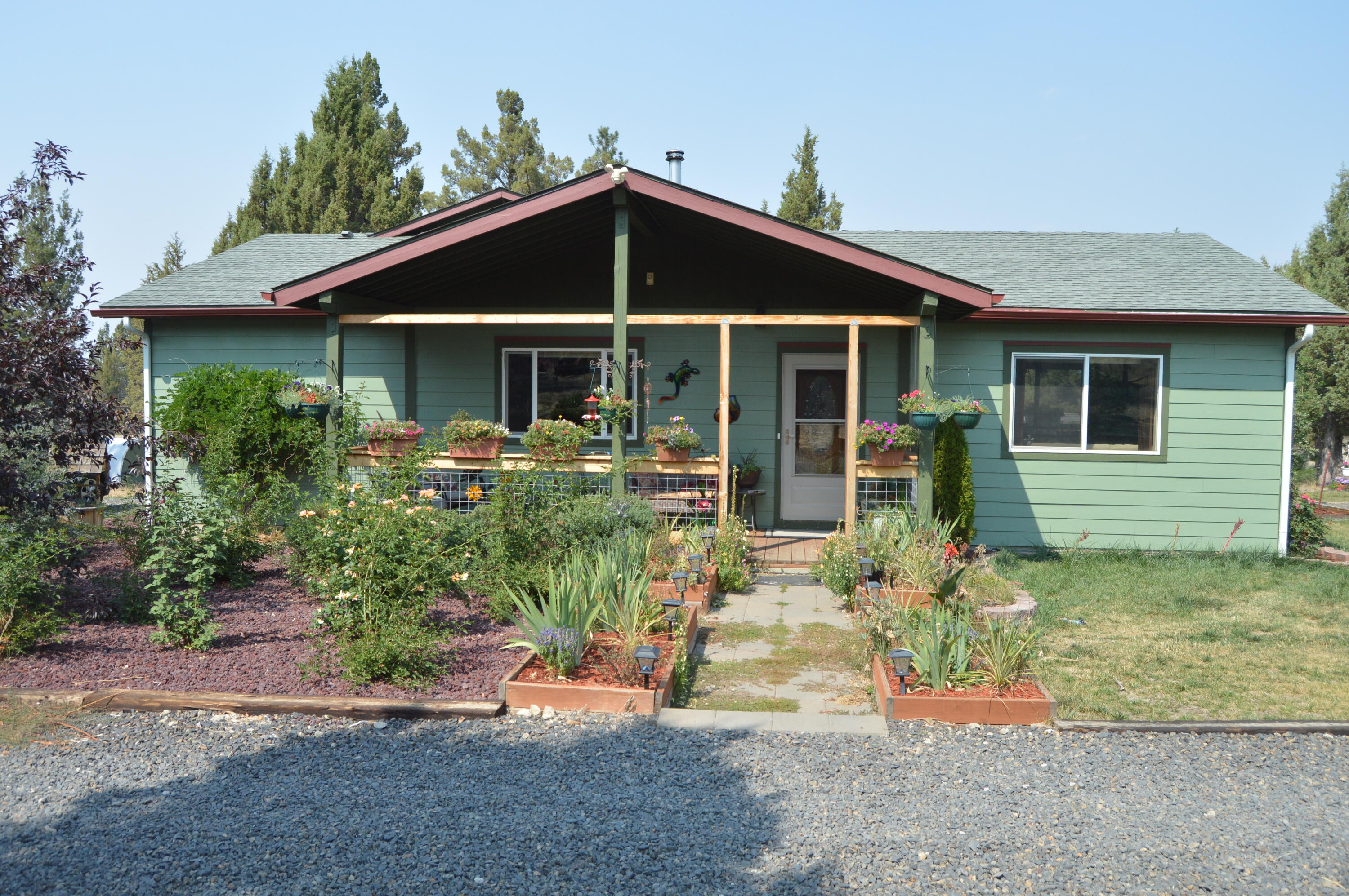 22915 Bliss Road Sprague River, OR 97639 - Photo 1 of 23 a front view of a house with garden