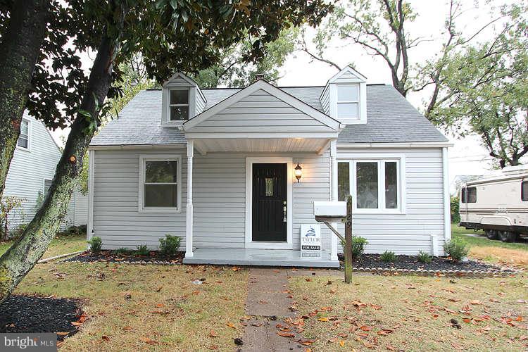 8129 Bullneck Road Baltimore, MD 21222 - Photo 1 of 30 a front view of a house with a yard