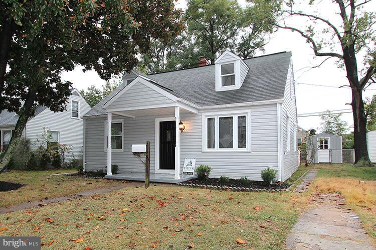 8129 Bullneck Road Baltimore, MD 21222 - Photo 2 of 30 a front view of a house with a yard