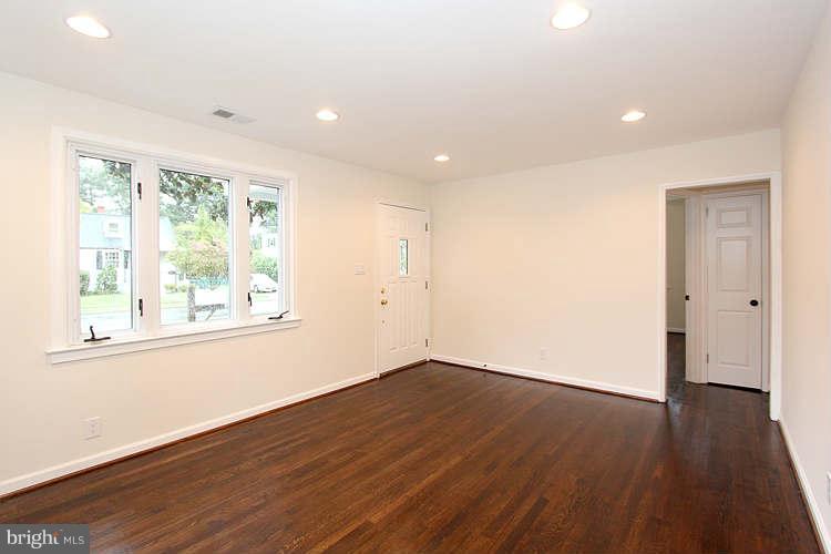 8129 Bullneck Road Baltimore, MD 21222 - Photo 15 of 30 an empty room with wooden floor and windows