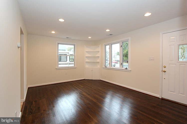 8129 Bullneck Road Baltimore, MD 21222 - Photo 16 of 30 a view of an empty room with wooden floor and a window