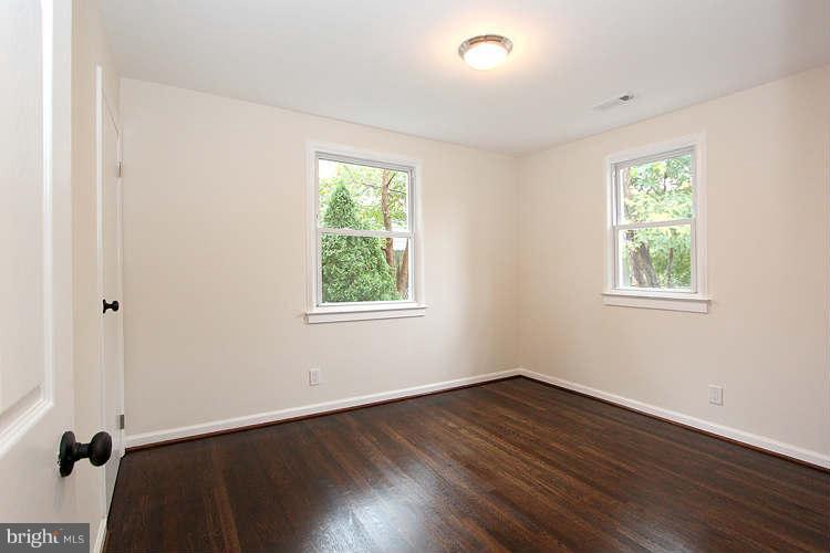 8129 Bullneck Road Baltimore, MD 21222 - Photo 21 of 30 a view of a room with wooden floor and windows
