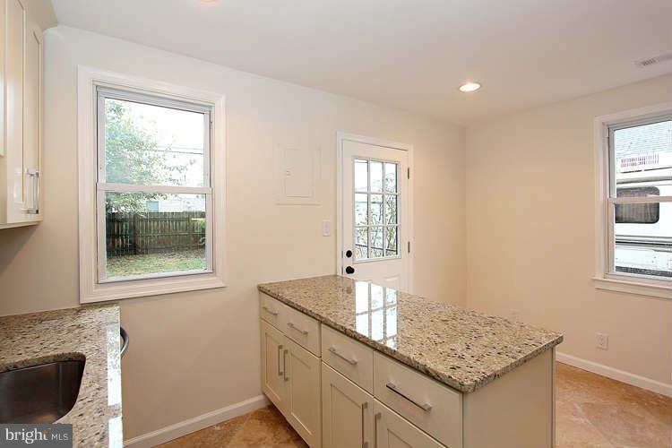 8129 Bullneck Road Baltimore, MD 21222 - Photo 9 of 30 a kitchen with granite countertop a sink and a window