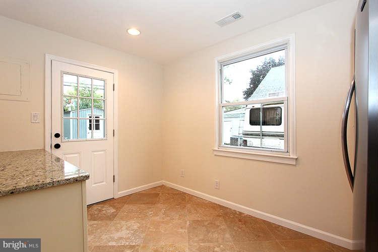 8129 Bullneck Road Baltimore, MD 21222 - Photo 10 of 30 a view of a kitchen with a sink and a window