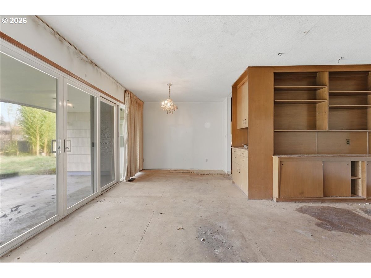 12333 Southeast Madison Street Portland, OR 97233 - Photo 11 of 28 a view of empty room with wooden floor