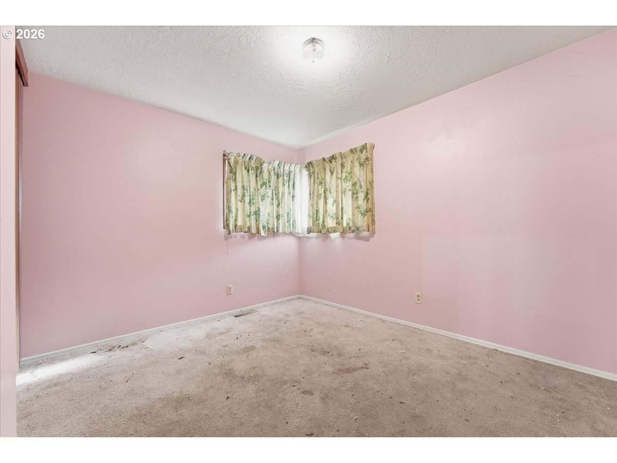 12333 Southeast Madison Street Portland, OR 97233 - Photo 17 of 28 a view of an empty room with a window