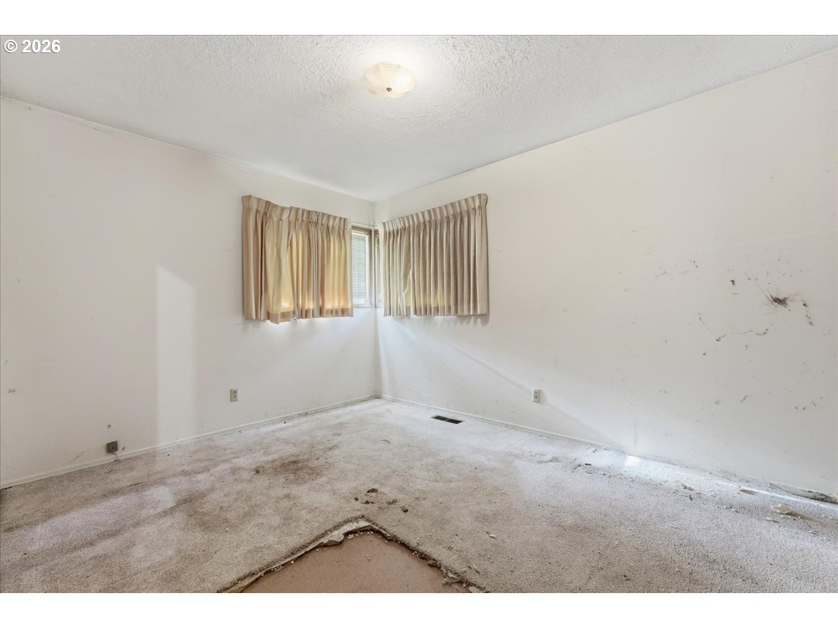 12333 Southeast Madison Street Portland, OR 97233 - Photo 19 of 28 a view of an empty room with a window