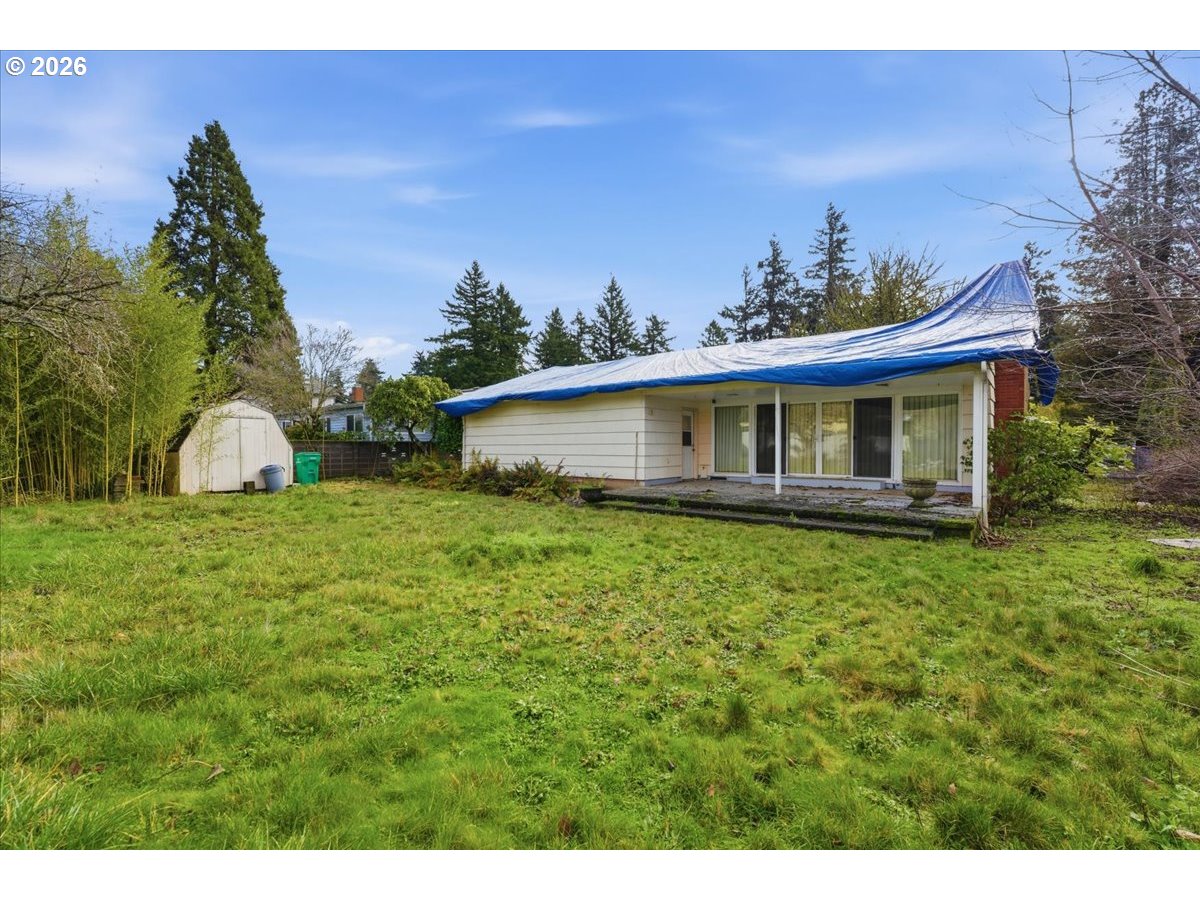 12333 Southeast Madison Street Portland, OR 97233 - Photo 25 of 28 a view of a house with a backyard