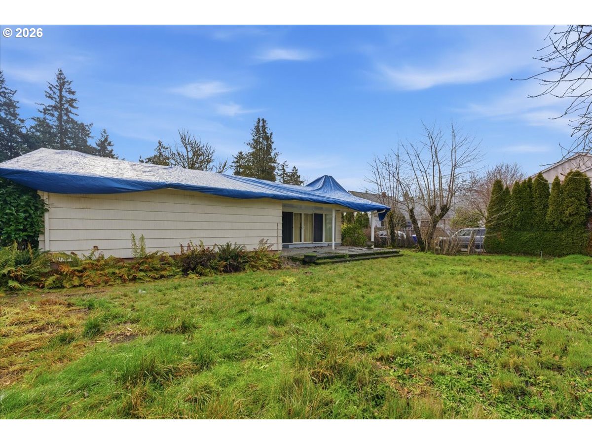 12333 Southeast Madison Street Portland, OR 97233 - Photo 26 of 28 a front view of a house with a garden