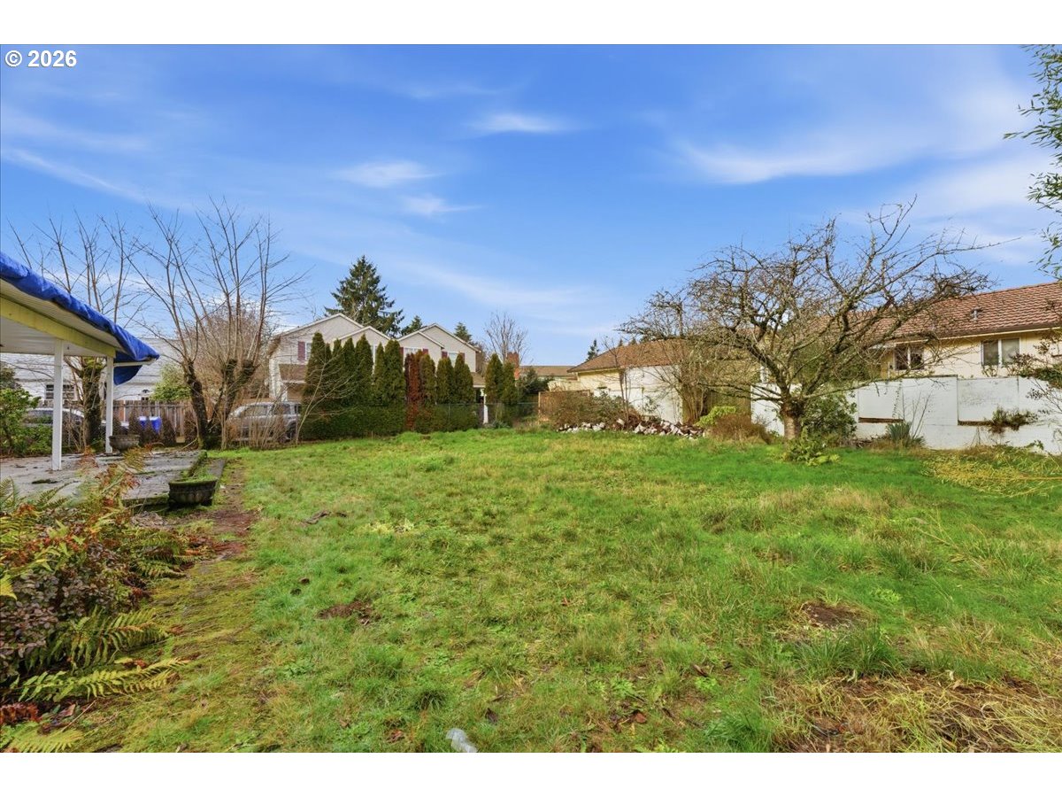 12333 Southeast Madison Street Portland, OR 97233 - Photo 27 of 28 a backyard of a house with lots of green space