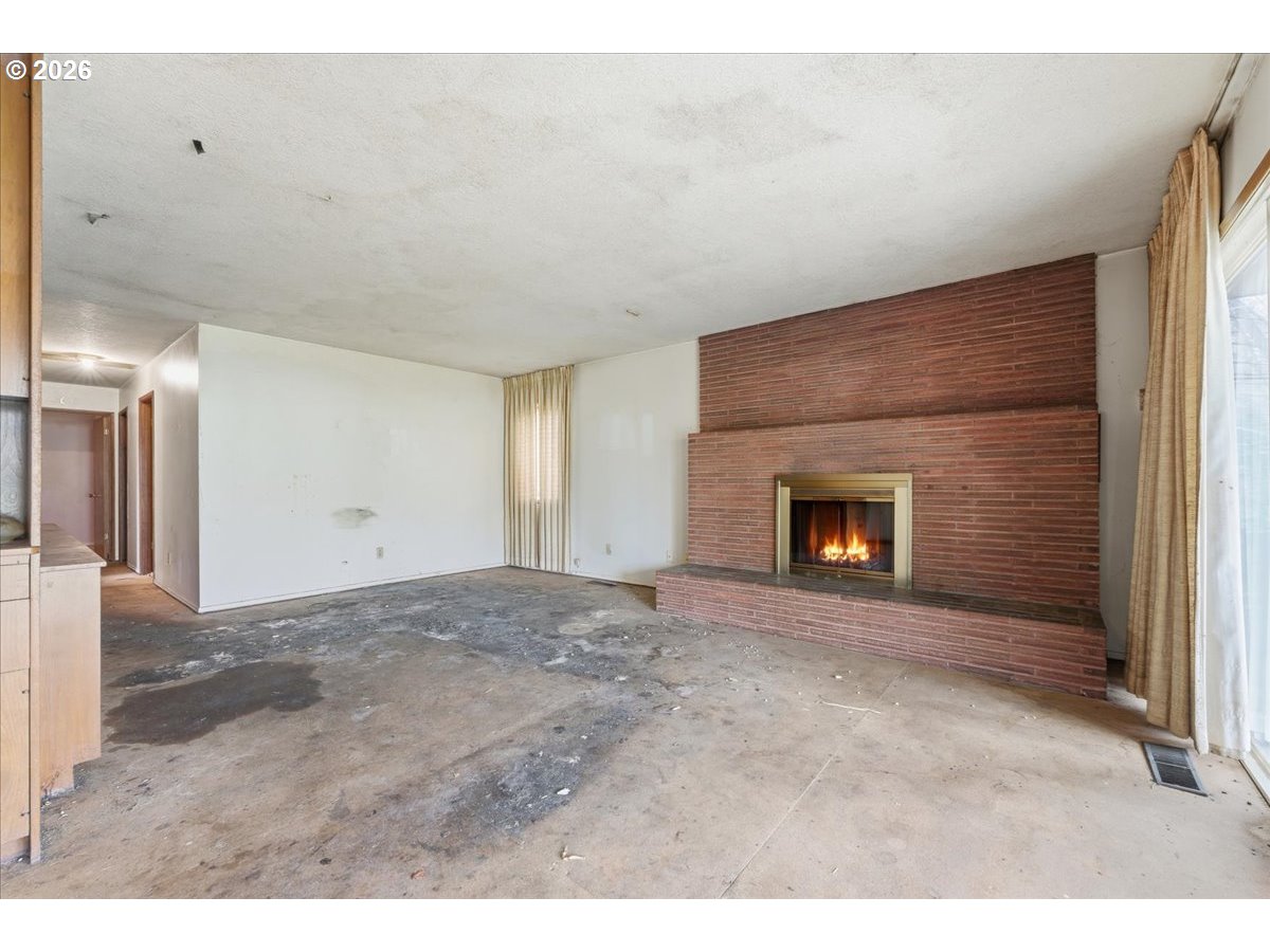 12333 Southeast Madison Street Portland, OR 97233 - Photo 6 of 28 a view of empty room with window
