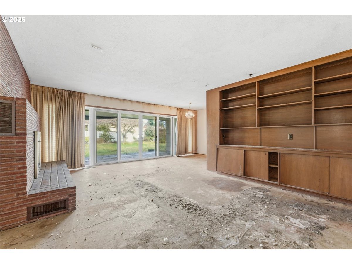 12333 Southeast Madison Street Portland, OR 97233 - Photo 9 of 28 a view of an empty room with a fireplace