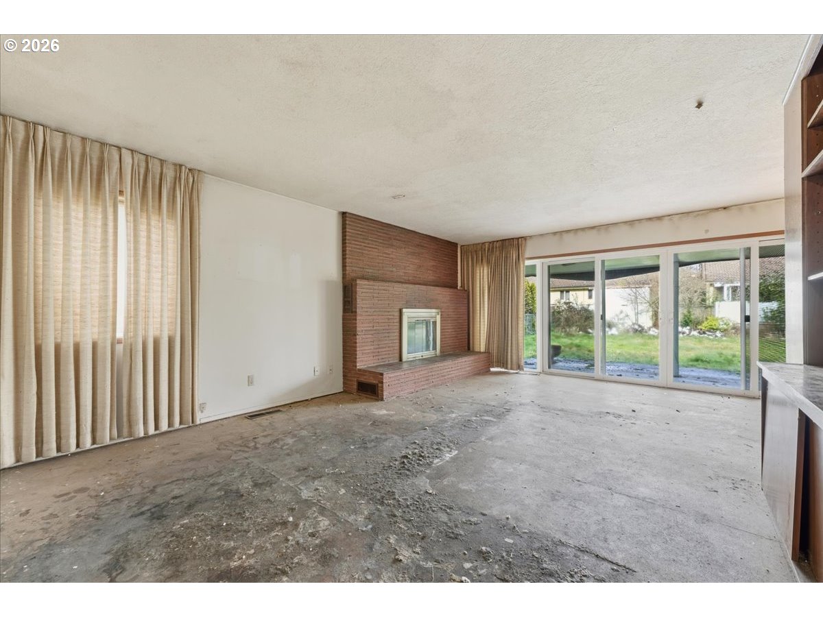 12333 Southeast Madison Street Portland, OR 97233 - Photo 10 of 28 a view of a room with an empty space and floor to ceiling window