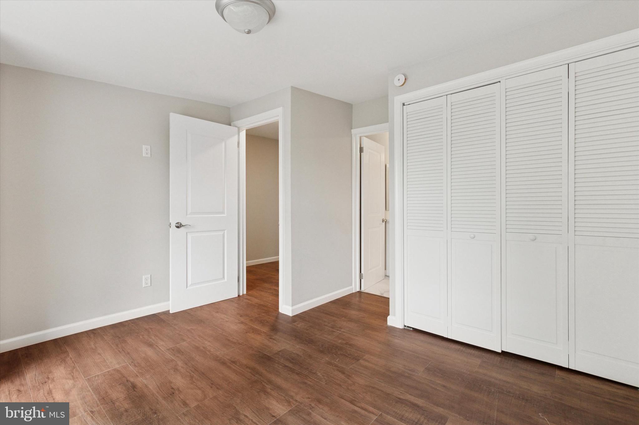 232 Main Street Hellertown, PA 18055 - Photo 11 of 13 a view of an empty room with wooden floor and closet