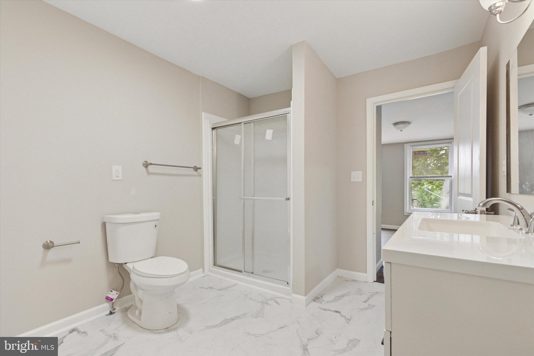 232 Main Street Hellertown, PA 18055 - Photo 8 of 13 a bathroom with a sink a toilet and shower
