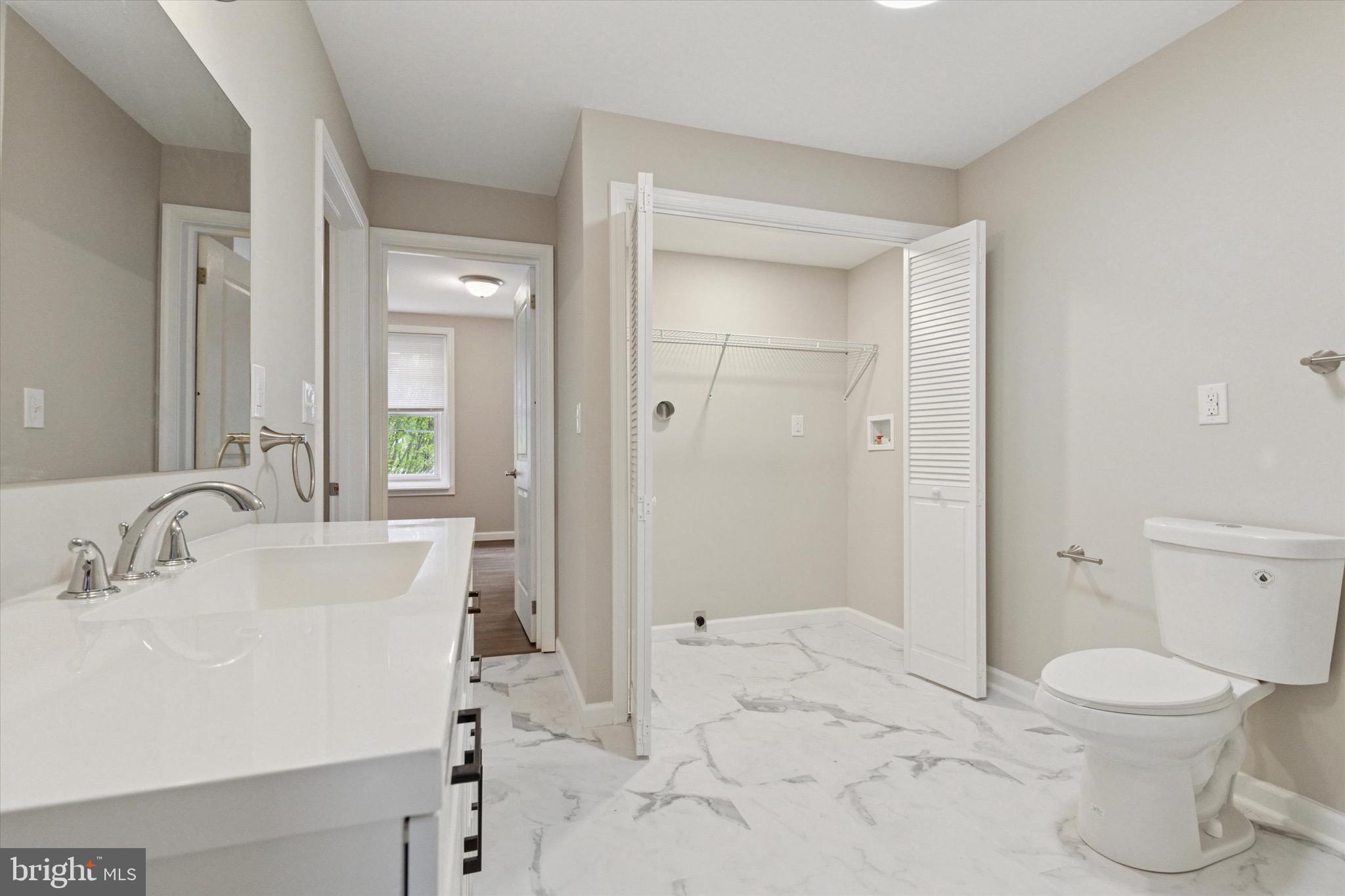 232 Main Street Hellertown, PA 18055 - Photo 9 of 13 a bathroom with a sink a toilet and shower