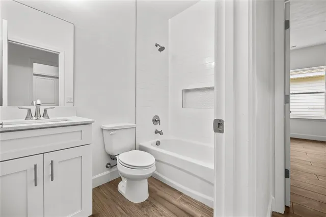 a bathroom with a toilet sink and a bathtub