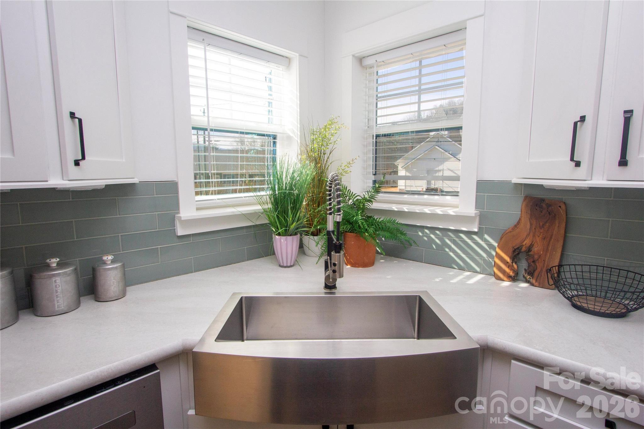 205 Southern Charm Road Arden, NC 28704 - Photo 11 of 34 a kitchen with a sink and a window