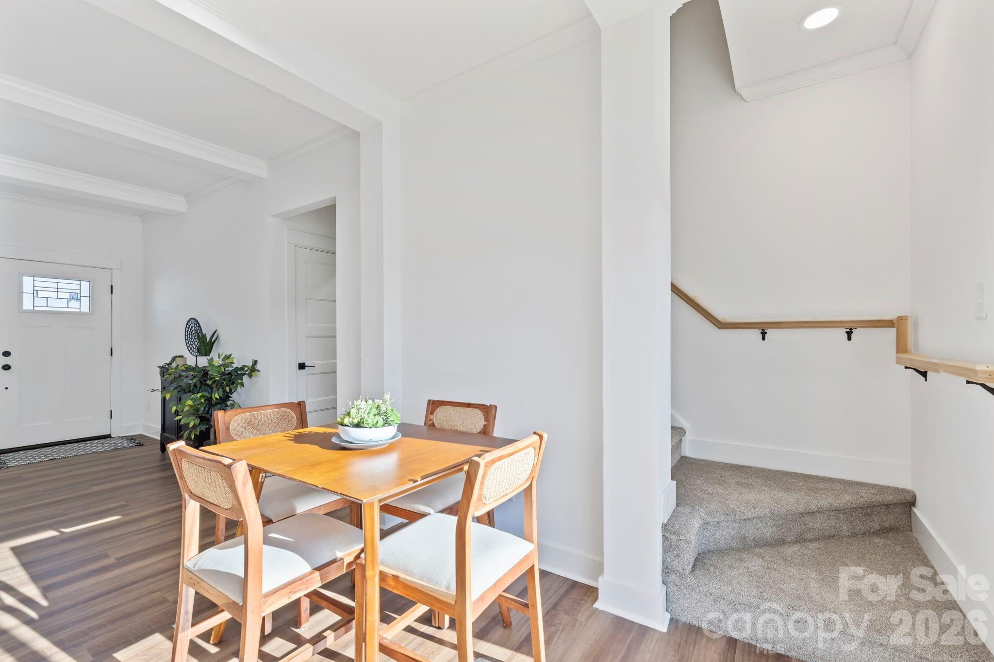 205 Southern Charm Road Arden, NC 28704 - Photo 21 of 34 a view of a dining room with furniture and wooden floor