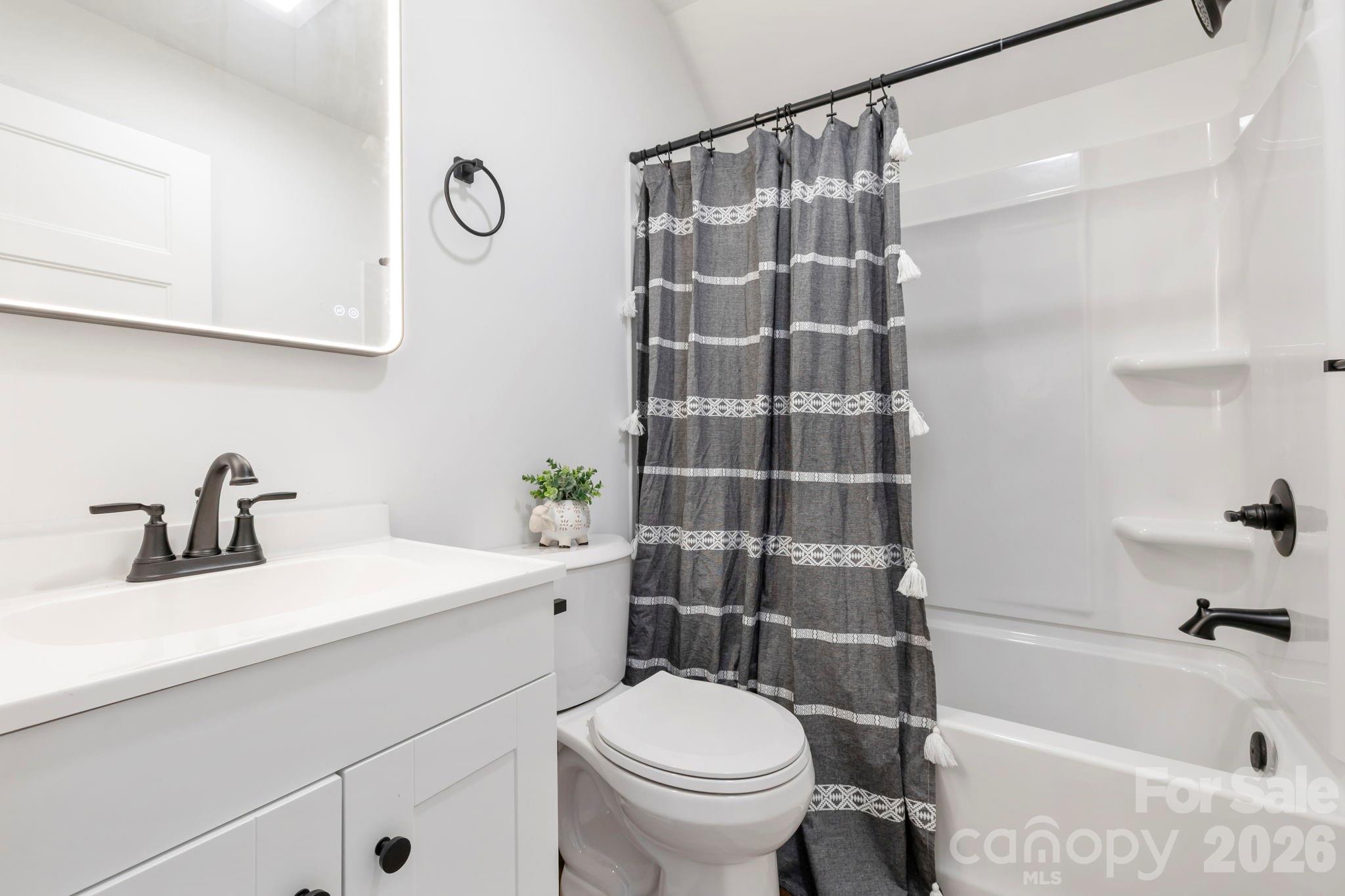 205 Southern Charm Road Arden, NC 28704 - Photo 26 of 34 a bathroom with a sink toilet and shower