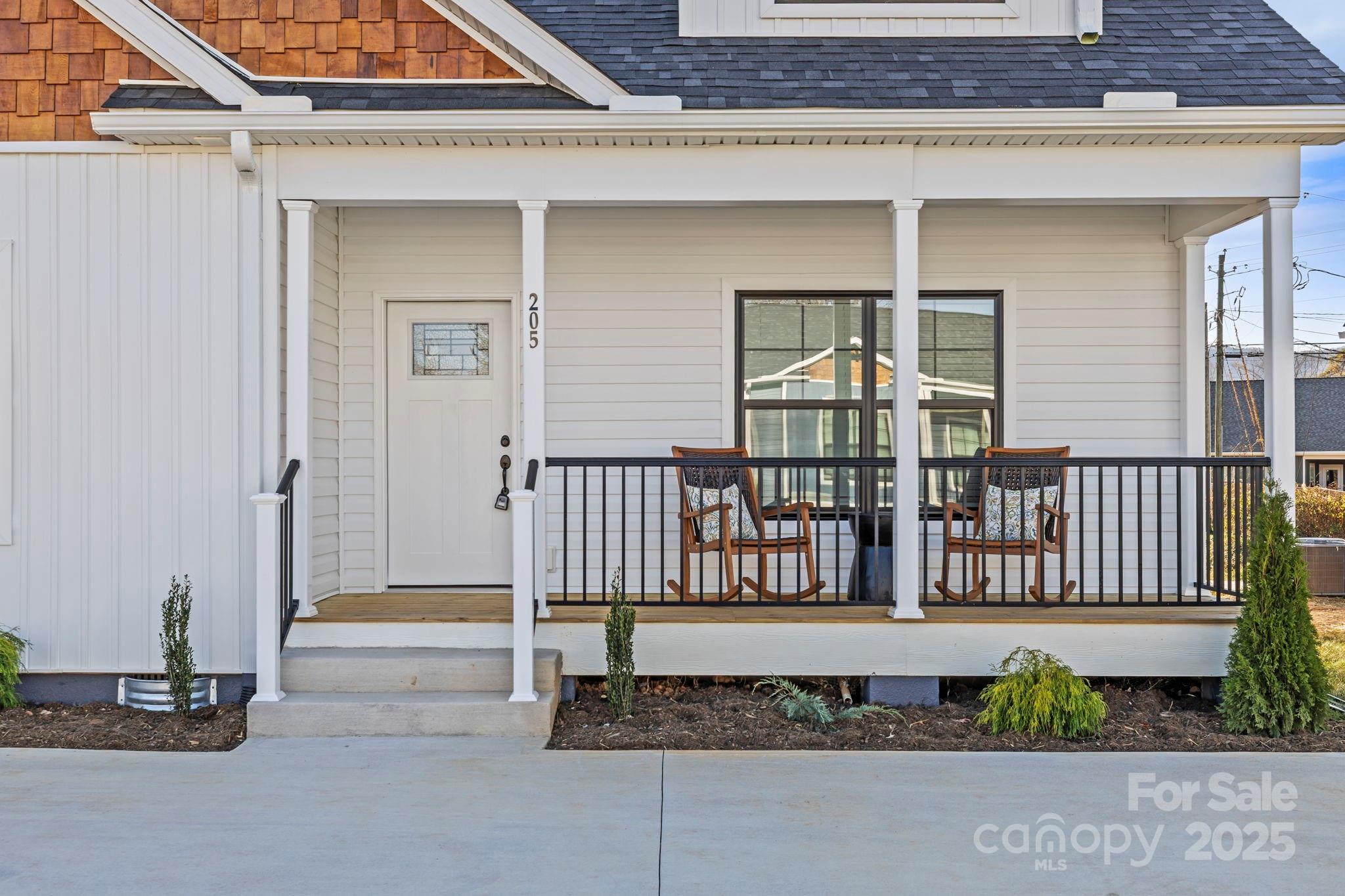 205 Southern Charm Road Arden, NC 28704 - Photo 3 of 26 a view of a house with a porch