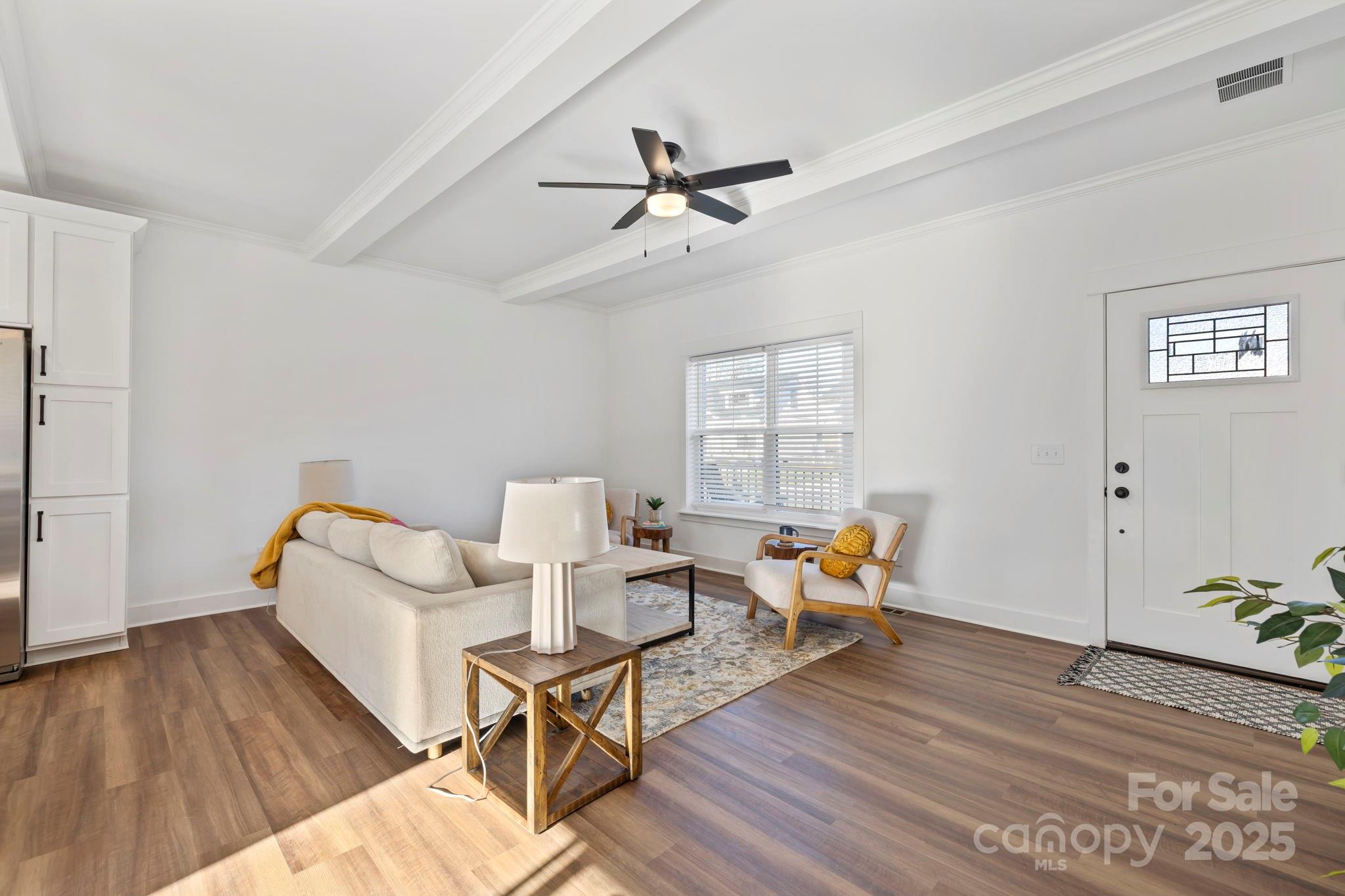 205 Southern Charm Road Arden, NC 28704 - Photo 6 of 26 a living room with furniture and a wooden floor