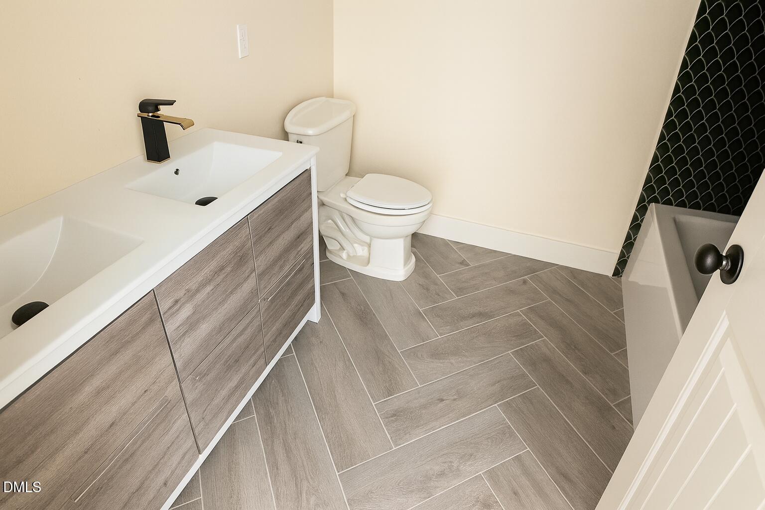 415 Gwen Road Hillsborough, NC 27278 - Photo 13 of 21 a bathroom with a toilet sink and mirror