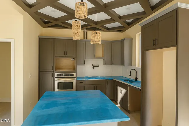 a white toilet sitting next to a white sink