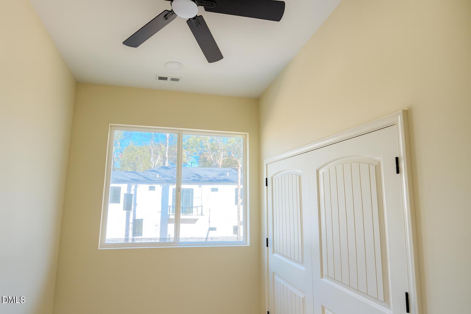 415 Gwen Road Hillsborough, NC 27278 - Photo 19 of 21 a view of empty room with wooden floor and window