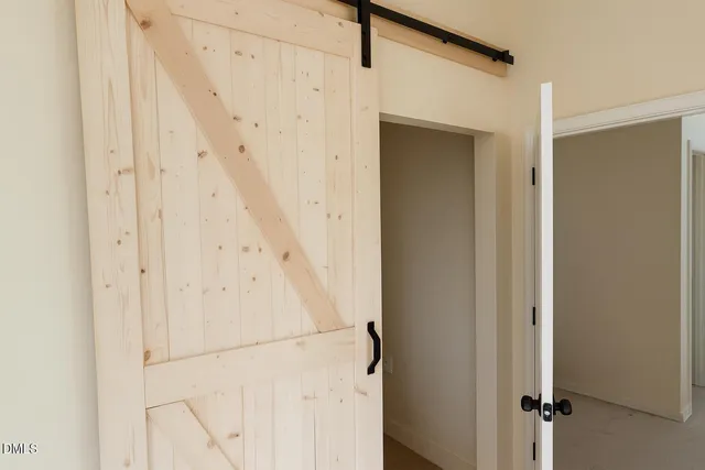 a view of a utility room with closet