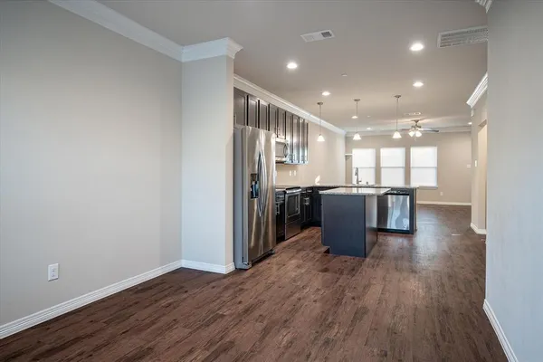 a view of kitchen with wooden floor