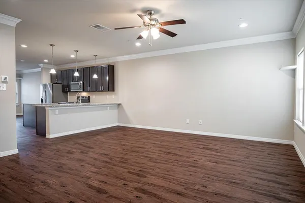 a view of a kitchen with a sink and a microwave