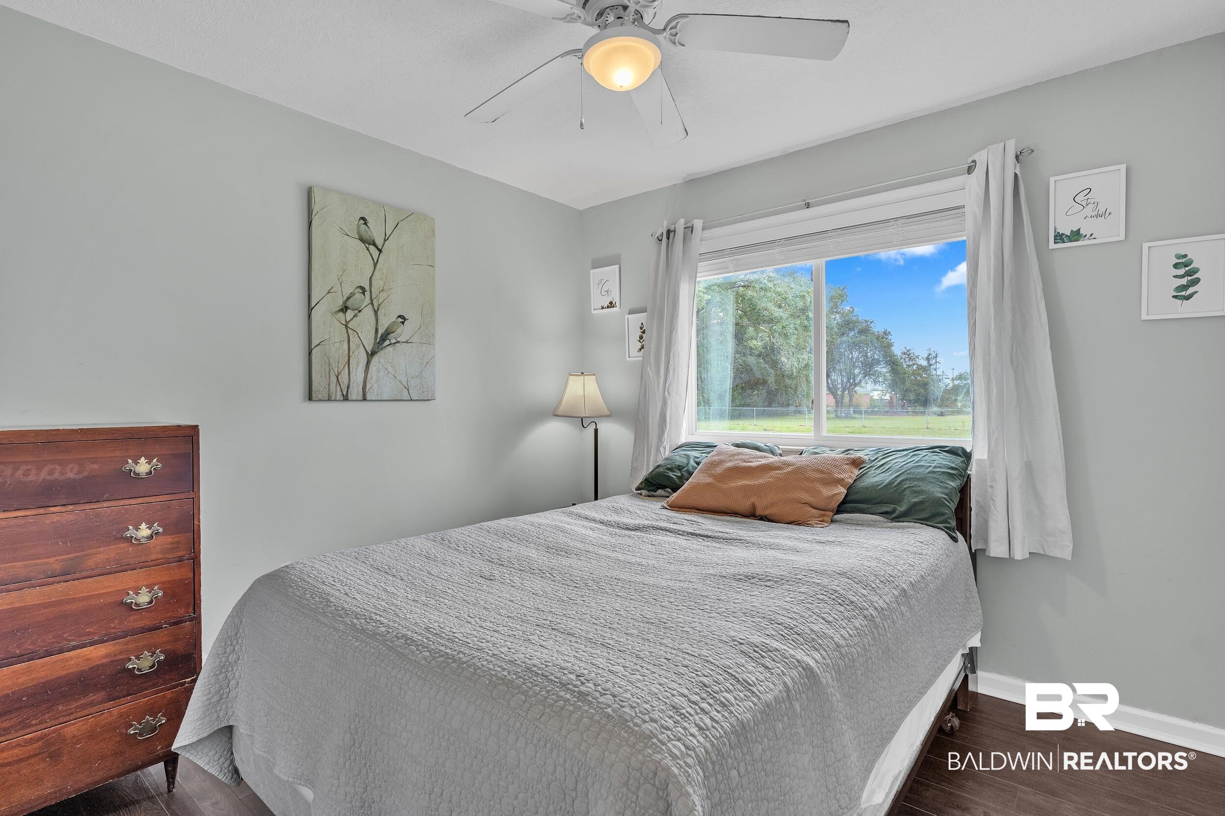 206 West Jackson Avenue Summerdale, AL 36580 - Photo 23 of 37 Bedroom with wood finished floors, baseboards, and a ceiling fan