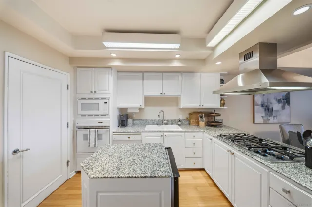 a living room with furniture potted plant and a table