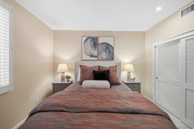 a bedroom with a bed and a bathroom