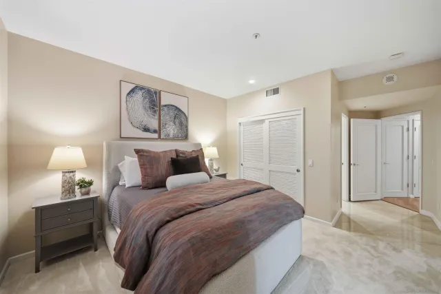 a bathroom with a granite countertop sink mirror and double