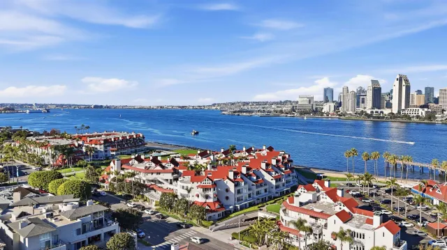 a living room with furniture large windows and rug view