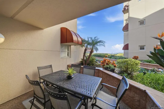 a view of an outdoor sitting area with furniture