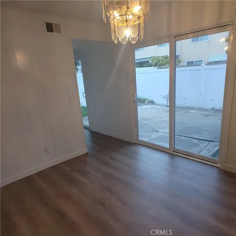 a kitchen with white cabinets and a sink