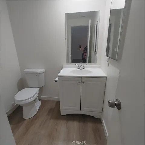 a bathroom with sink shower and mirror