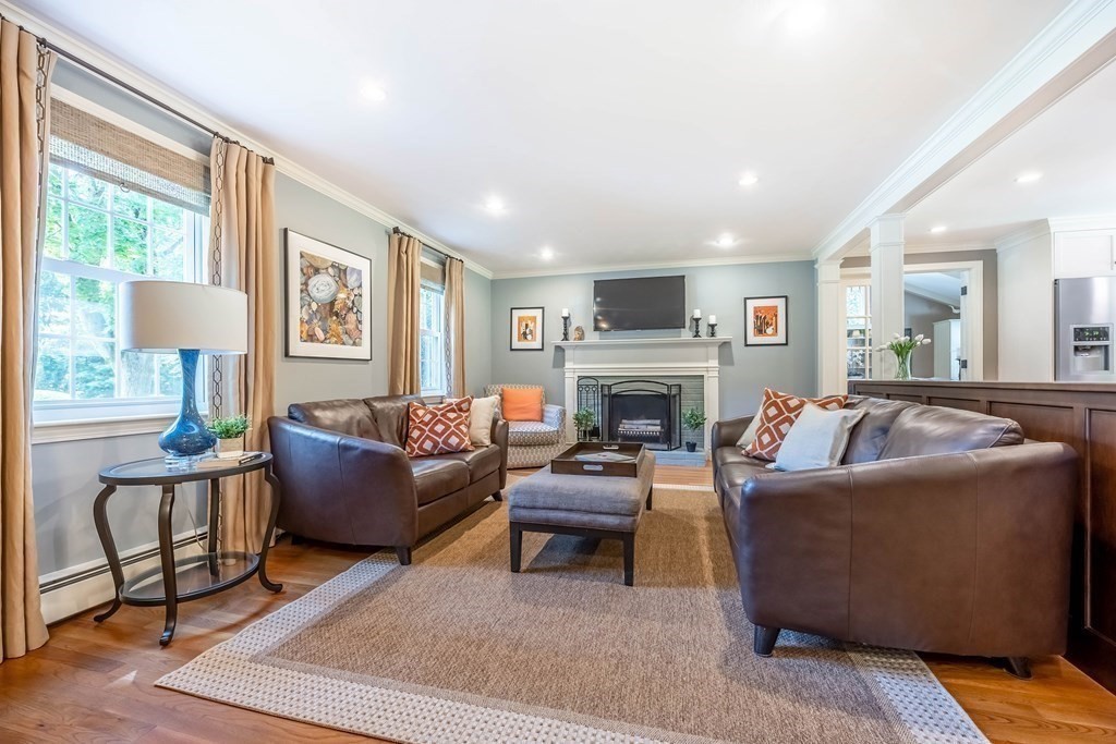 1 Rennie Drive Andover, MA 01810 - Photo 11 of 39 a living room with furniture a fireplace and a large window
