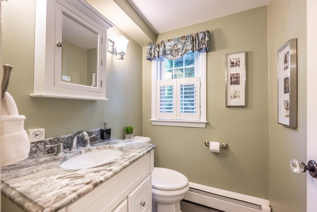 1 Rennie Drive Andover, MA 01810 - Photo 19 of 39 a bathroom with a granite countertop toilet sink and mirror
